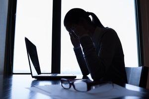 Laptop business user dark office